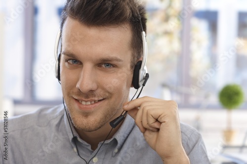 Photo: Closeup portrait of handsome dispatcher Closeup portrait of handsome dispatcher