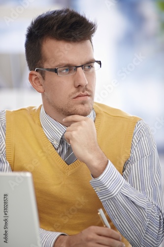 Photo: Closeup portrait of daydreaming man Closeup portrait of daydreaming man