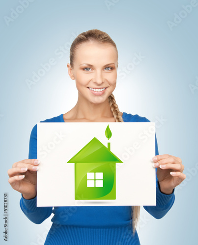 Photo: woman with illustration of green eco house woman with illustration of green eco house