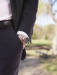Businessman's hand in the pocket with wristwatch.