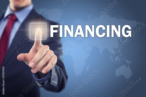 Photo: Man touching display Financing Man touching display Financing