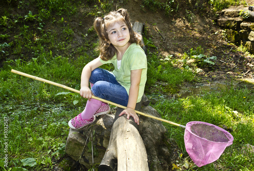 Photo: Cute toddler holding a butterfly net Cute toddler holding a butterfly net