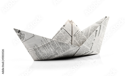 Photo: origami paper ship isolated on white origami paper ship isolated on white