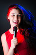 Female performer at disco with mic