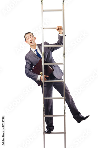 Photo: Businessman climbing the ladder isolated on white Businessman climbing the ladder isolated on white
