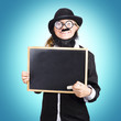 Funny science teacher holding blank chalkboard