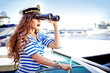 Attractive girl on a yacht at summer day