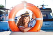 Attractive girl on a yacht at summer day