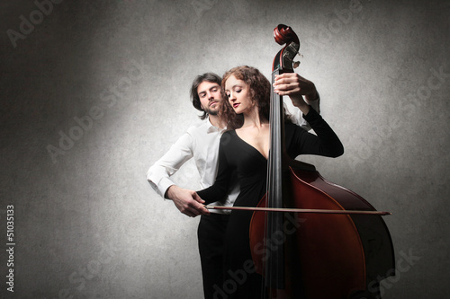 Photo: couple playing contrabass couple playing contrabass