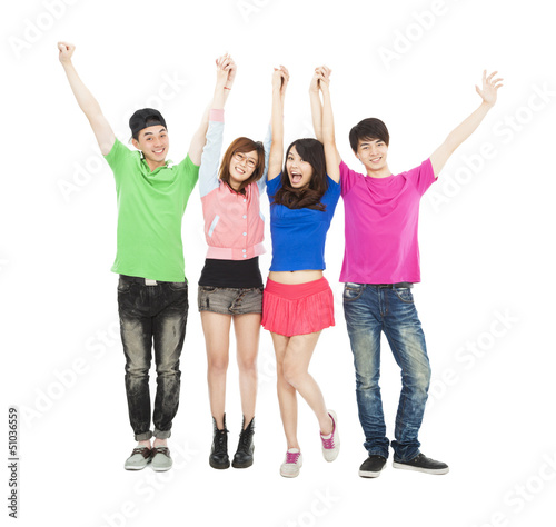 Photo: happy young group standing with hands up together happy young group standing with hands up together