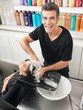 Photo: Hairstylist Washing Customer's Hair Hairstylist Washing Customer's Hair