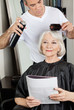 Hairstylist Setting Up Client's Hair At Salon