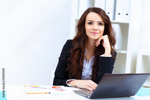 Photo: Young busines woman with notebook Young busines woman with notebook