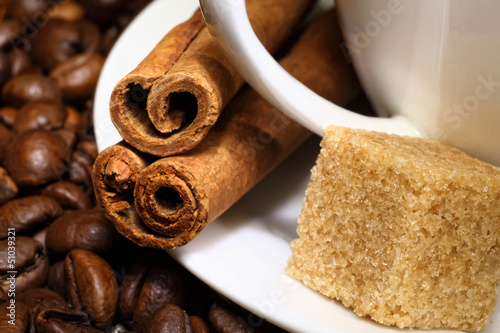 Photo: Coffee beans and white cup Coffee beans and white cup
