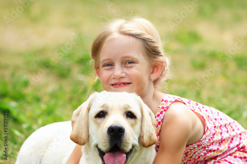 Photo: little girl with her dog little girl with her dog