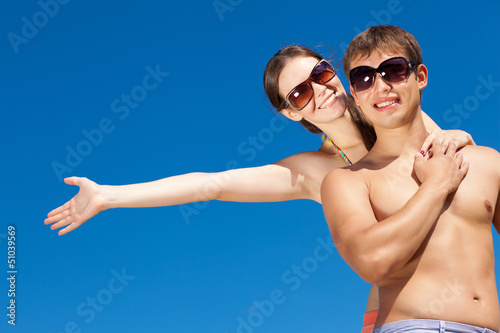 Photo: Happy Young Couple Together On The Beach Happy Young Couple Together On The Beach