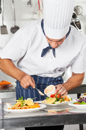 Photo: Chef Garnishing Dish With Mayonnaise Chef Garnishing Dish With Mayonnaise