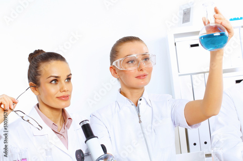 Photo: Team of scientists working in laboratory Team of scientists working in laboratory