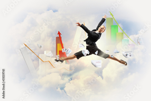 Photo: businesswoman in black suit jumping businesswoman in black suit jumping