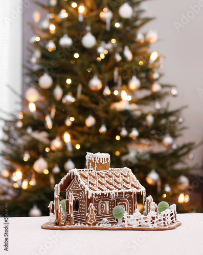 Photo: Gingerbread cottage with Christmas tree Gingerbread cottage with Christmas tree