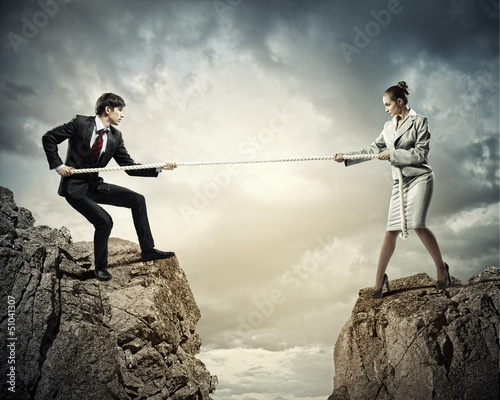 Photo: People pull the rope. People pull the rope.