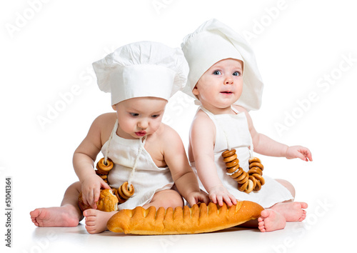 Photo: Little bakers kids boy and girl Little bakers kids boy and girl