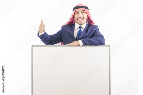 Photo: Arab man with blank board for message Arab man with blank board for message
