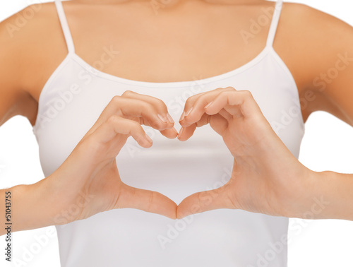 Photo: woman's hands showing heart shape woman's hands showing heart shape