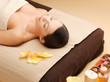 woman in spa salon lying on the massage desk