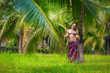 girl with green coconuts