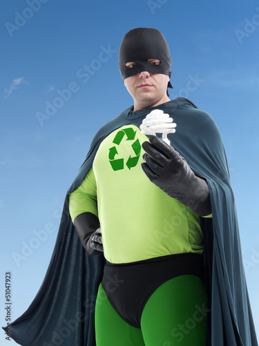 Photo: Eco superhero and CFL bulb Eco superhero and CFL bulb