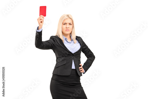 Photo: Angry businesswoman holding a red card Angry businesswoman holding a red card