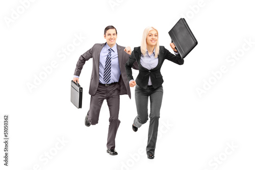 Photo: Full length portrait of a businesspeople with briefcases running Full length portrait of a businesspeople with briefcases running