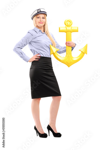 Photo: Full length portrait of a young sailor woman with an anchor Full length portrait of a young sailor woman with an anchor