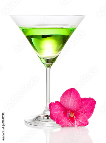 Photo: glass with cocktail and gladiolus bud isolated on white glass with cocktail and gladiolus bud isolated on white