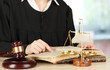 Judge sitting at table during court hearings on room background