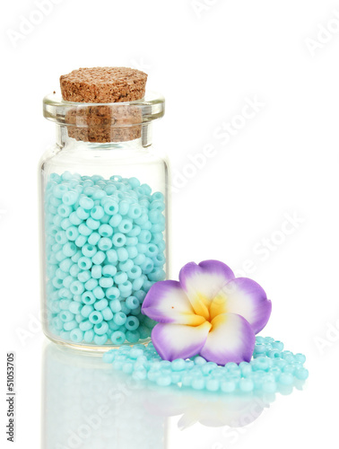 Photo: Little bottle full with colorful beads isolated on white Little bottle full with colorful beads isolated on white