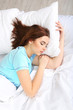 Beautiful young woman sleeping in bed