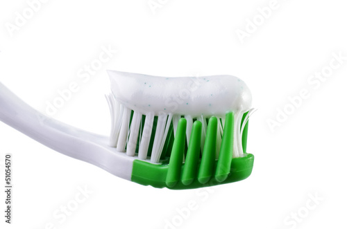 Photo: Toothbrush with toothpaste isolated over white Toothbrush with toothpaste isolated over white