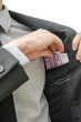 Man putting money in his pocket