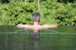 Photo: Man relaxing at pool Man relaxing at pool
