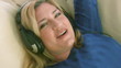 Woman listening to music with headphones