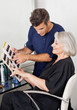 Customer And Hairstylist Selecting Hair Color