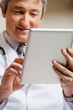 Doctor Using Digital Tablet