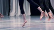 Men and women dressed in black dancing barefoot. 240 fps