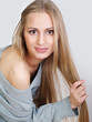 Foto: Portrait of the smiling girl with a long fair hair Portrait of the smiling girl with a long fair hair