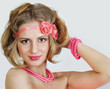 Foto: Young girl with a fair hair and a bright make-up Young girl with a fair hair and a bright make-up
