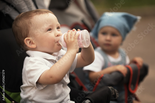 Photo: cute baby drinks juice cute baby drinks juice