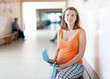 pregnant woman waits to receive doctor