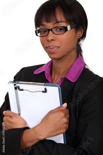 Photo: Businesswoman holding clipboard Businesswoman holding clipboard